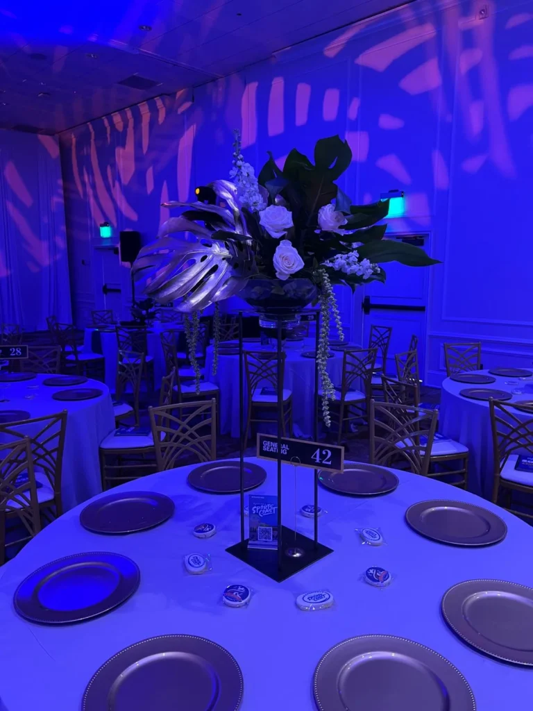 Evening celebration floral arrangements with ambient lighting